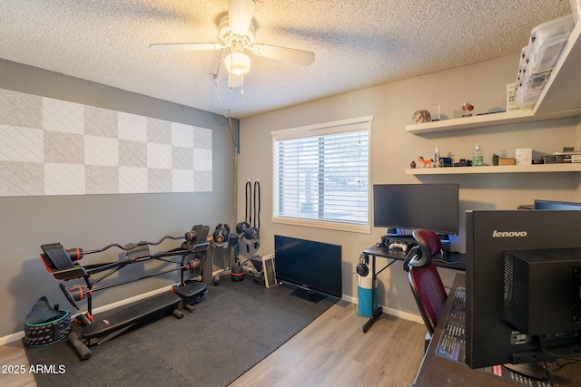 602 E Colgate Dr, Tempe, AZ 85283 - workout room with wood finished floors, a textured ceiling, ceiling fan, and baseboards