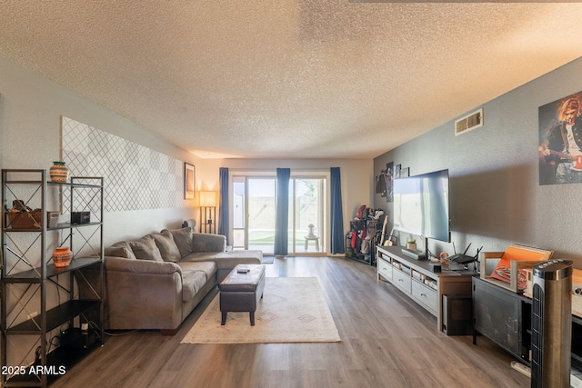 602 E Colgate Dr, Tempe, AZ 85283 - living room featuring a textured ceiling, wood finished floors, and a textured wall