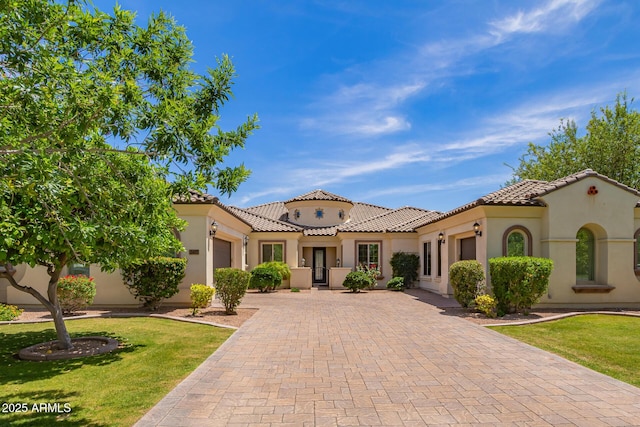 2457 E Melrose St, Mesa, AZ 85213 - mediterranean / spanish-style house with an attached garage, decorative driveway, and stucco siding