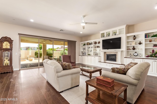2457 E Melrose St, Mesa, AZ 85213 - living area featuring ceiling fan, a fireplace with raised hearth, wood finished floors, recessed lighting, and baseboards