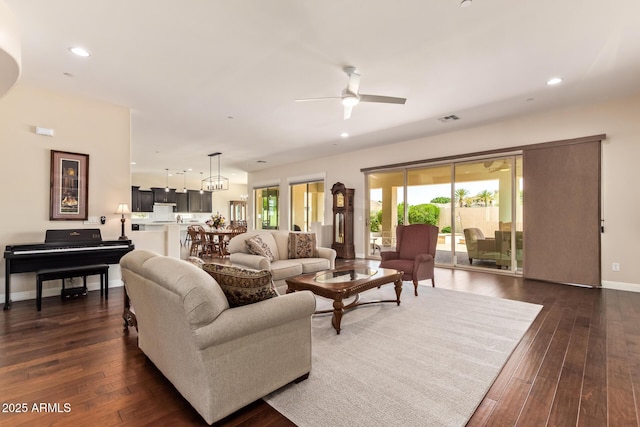 2457 E Melrose St, Mesa, AZ 85213 - living room with a ceiling fan, dark wood-type flooring, recessed lighting, and baseboards