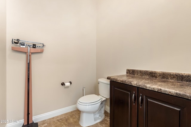 2457 E Melrose St, Mesa, AZ 85213 - half bathroom with toilet, baseboards, and tile patterned flooring