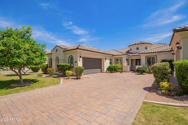 2457 E Melrose St, Mesa, AZ 85213 - mediterranean / spanish home with an attached garage, decorative driveway, stucco siding, and a tile roof