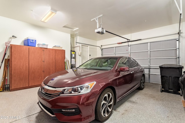 2457 E Melrose St, Mesa, AZ 85213 - garage featuring a garage door opener and electric water heater