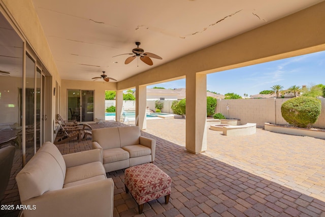 2457 E Melrose St, Mesa, AZ 85213 - fenced backyard featuring a patio, outdoor lounge area, and ceiling fan