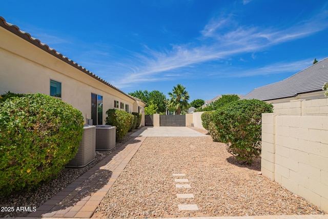 2457 E Melrose St, Mesa, AZ 85213 - fenced backyard featuring central AC unit and a patio area