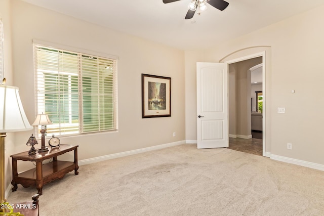 2457 E Melrose St, Mesa, AZ 85213 - sitting room with carpet flooring, arched walkways, ceiling fan, and baseboards