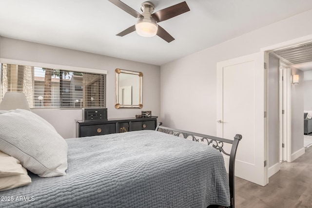 6480 N 82nd St Unit 1136, Scottsdale, AZ 85250 - bedroom featuring wood finished floors, baseboards, and a ceiling fan