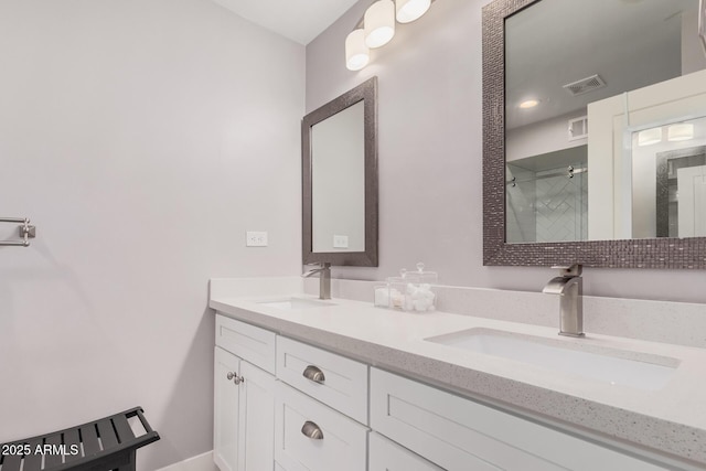 6480 N 82nd St Unit 1136, Scottsdale, AZ 85250 - bathroom featuring double vanity and a shower with door