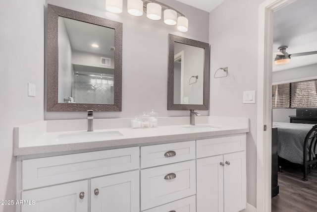 6480 N 82nd St Unit 1136, Scottsdale, AZ 85250 - ensuite bathroom with double vanity, wood finished floors, and a shower with door