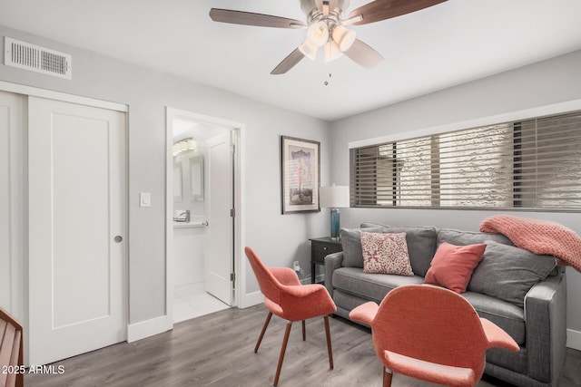 6480 N 82nd St Unit 1136, Scottsdale, AZ 85250 - living room featuring wood finished floors, ceiling fan, and baseboards