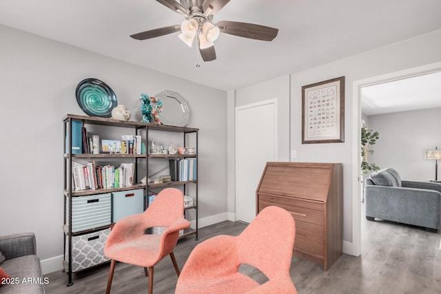 6480 N 82nd St Unit 1136, Scottsdale, AZ 85250 - living area featuring a ceiling fan, baseboards, and wood finished floors