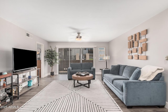 6480 N 82nd St Unit 1136, Scottsdale, AZ 85250 - living room featuring dark wood-type flooring, ceiling fan, and baseboards