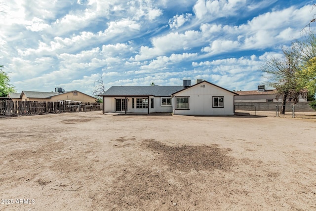 6701 W Monterey Way, Phoenix, AZ 85033 - back of property with a fenced backyard and central AC unit
