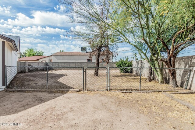 6701 W Monterey Way, Phoenix, AZ 85033 - view of yard with a gate and fence