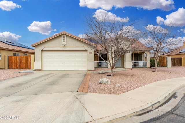 ranch-style house with stucco siding, a garage, covered porch, and fence