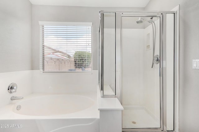 full bath featuring a garden tub and a stall shower