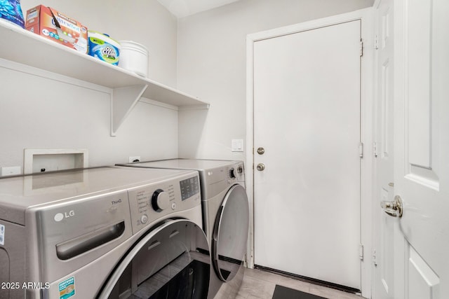 clothes washing area with laundry area and independent washer and dryer