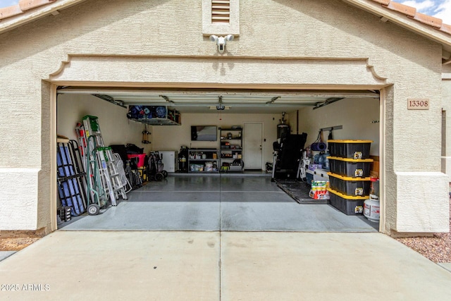 garage with concrete driveway