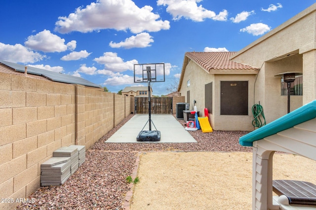 view of patio featuring central AC, a fenced backyard, and a gate