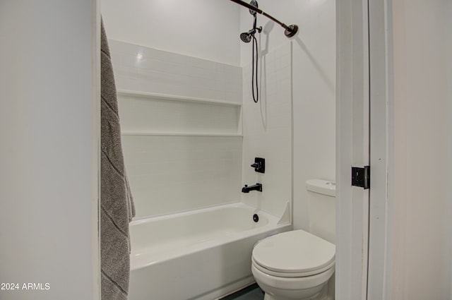 bathroom with toilet and bathtub / shower combination