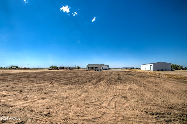 view of yard with a rural view