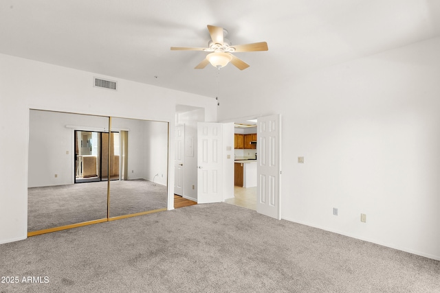 19400 N Westbrook Pkwy Unit 220, Peoria, AZ 85382 - unfurnished bedroom with light colored carpet, a closet, and a ceiling fan