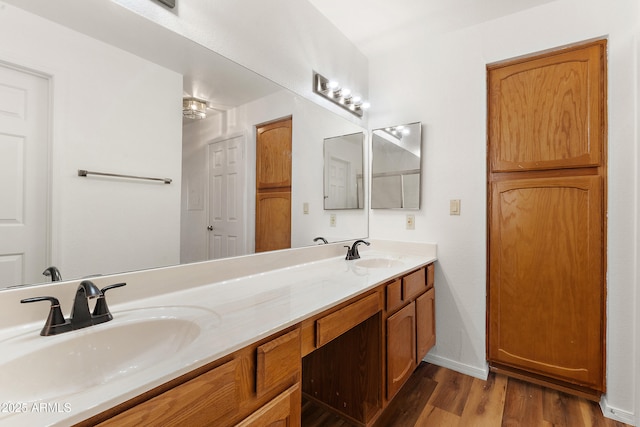 19400 N Westbrook Pkwy Unit 220, Peoria, AZ 85382 - bathroom featuring double vanity and wood finished floors