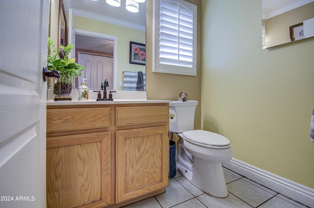 bathroom with vanity, ornamental molding, toilet, and tile patterned floors