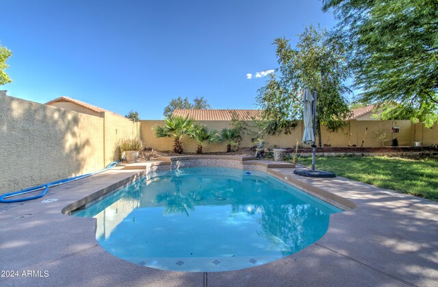 view of patio featuring a fenced in pool