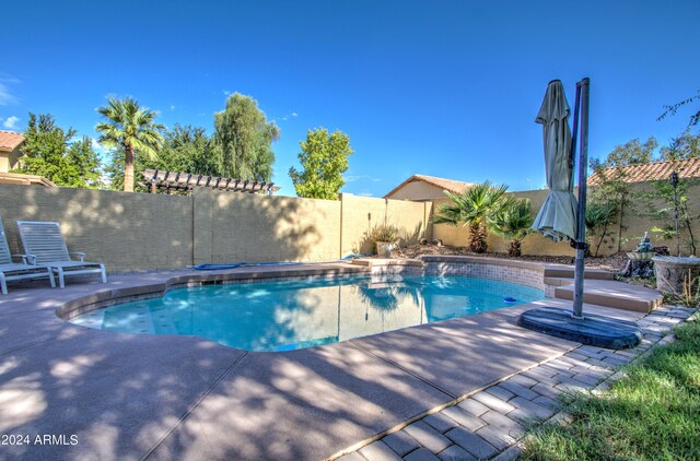 view of patio with area for grilling and exterior kitchen