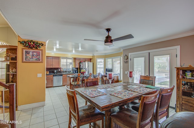 tiled dining area featuring french doors, ceiling fan, and crown molding