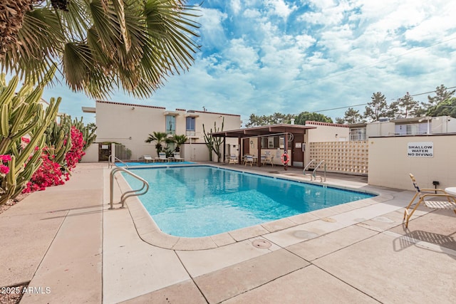 view of swimming pool with a patio area