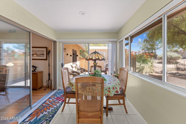 tiled dining room with plenty of natural light