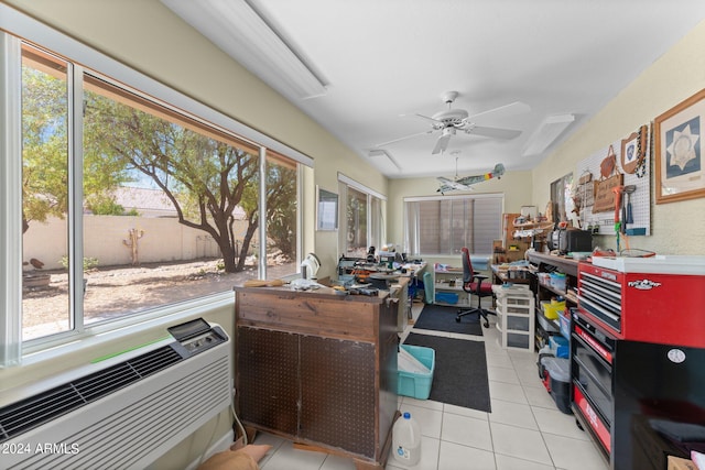 home office featuring ceiling fan, light tile patterned flooring, and a healthy amount of sunlight