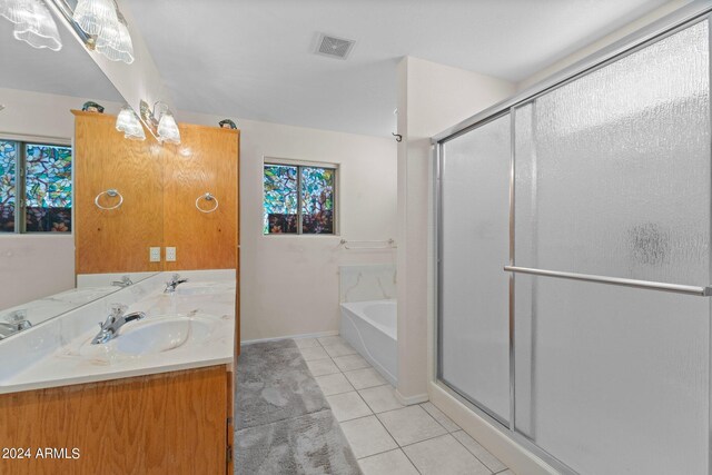 bathroom featuring vanity, tile patterned floors, and shower with separate bathtub