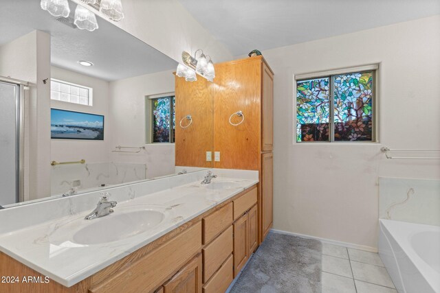 bathroom featuring plus walk in shower, tile patterned flooring, and vanity