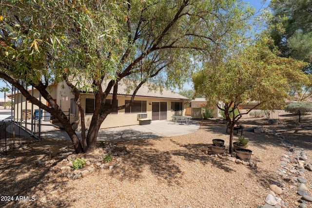 rear view of property with a patio