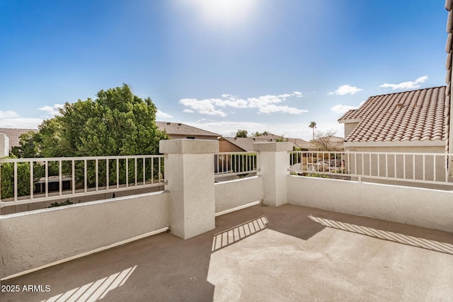 view of patio featuring a balcony