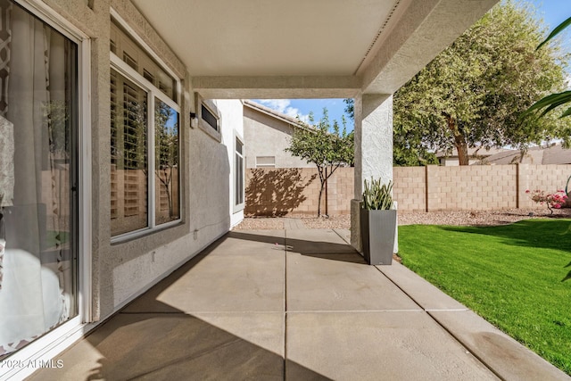 view of patio with fence