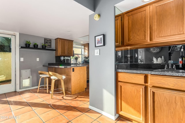 kitchen with sink and light tile patterned floors