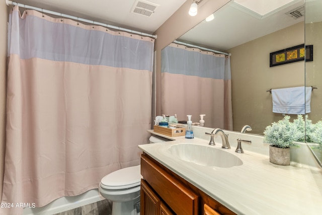 full bathroom featuring vanity, toilet, shower / tub combo, and hardwood / wood-style floors