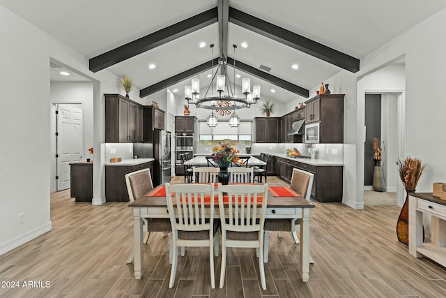 dining space with beam ceiling, high vaulted ceiling, and a chandelier