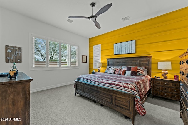 bedroom with light carpet and ceiling fan