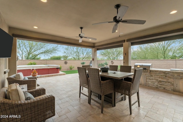 view of patio with ceiling fan and a grill