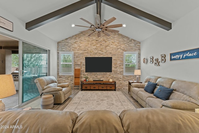 living room with beam ceiling, light hardwood / wood-style floors, high vaulted ceiling, and ceiling fan