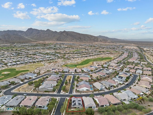 birds eye view of property with a mountain view