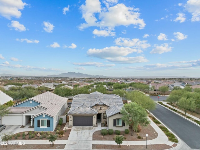 birds eye view of property with a mountain view