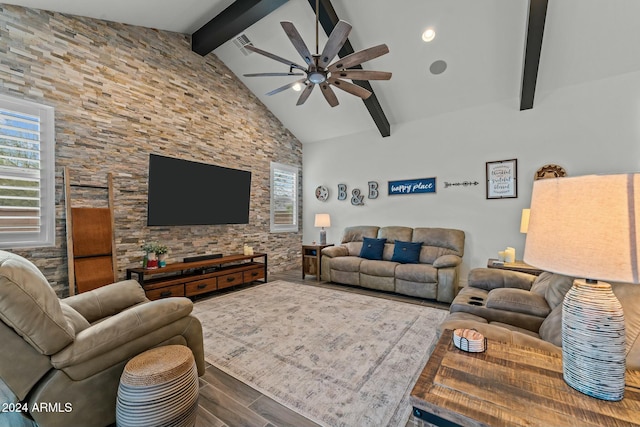 living room with ceiling fan, beam ceiling, and high vaulted ceiling