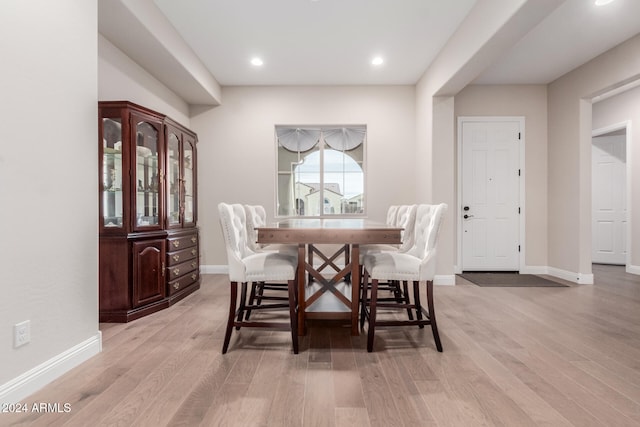 dining space with light wood-type flooring